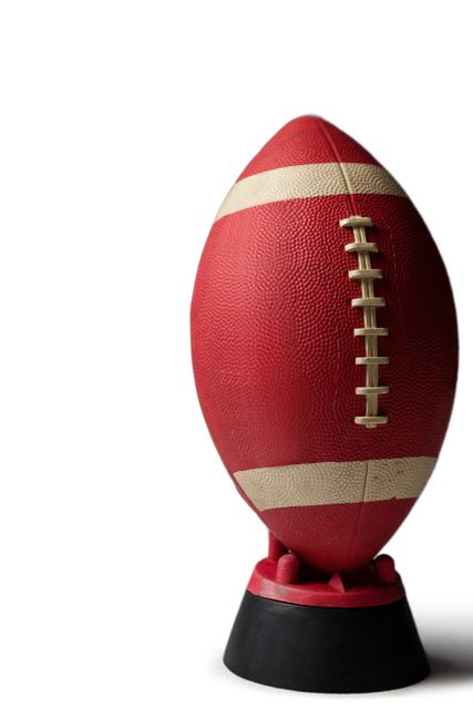 This image shows an American football placed on a tee, isolated against a white background. It is ideal for use in sports-related content, advertisements for football equipment, training materials, and promotional materials for football events. The clean background makes it easy to integrate into various designs and layouts.