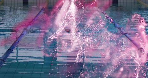 Colorful water jet display in swimming pool lane