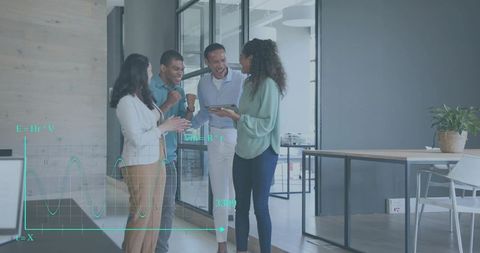 Team Celebrating Success While Reviewing Data on Tablet in Modern Open-Plan Office