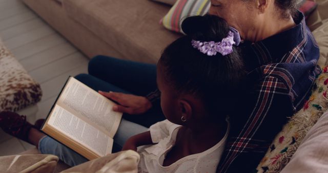 Mother and Daughter Reading Book Together on Couch - Download Free Stock Images Pikwizard.com