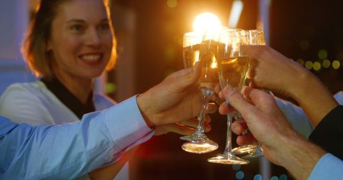 Friends Celebrating with Champagne Toast at Night Party - Download Free Stock Images Pikwizard.com