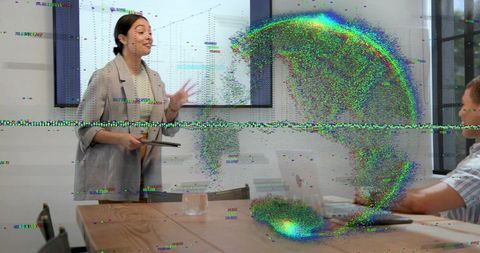 Presenter pointing at chart delivering data with colorful glitch distortion in boardroom