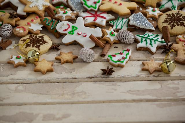 Various christmas cookies and decoration on a plank