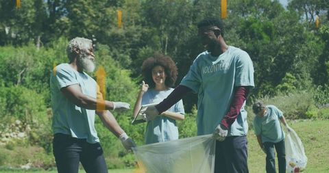 Volunteers Collecting Litter in a Lush Countryside Setting