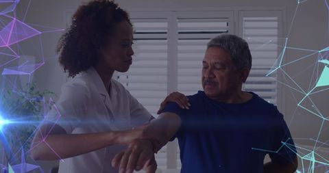 Doctor assisting elderly patient with exercise