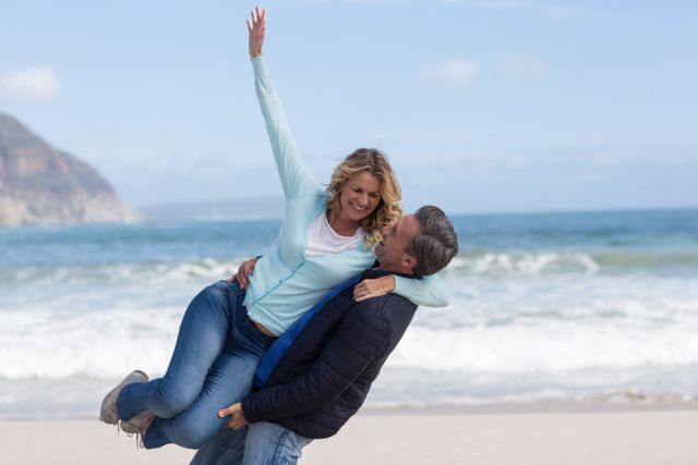 Romantic mature couple enjoying on the beach