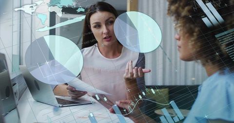 Two Businesswomen Collaborating in Modern Digital Office