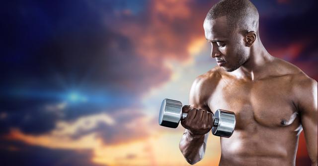 Muscular man working out with dumb bells against cloudy sky background