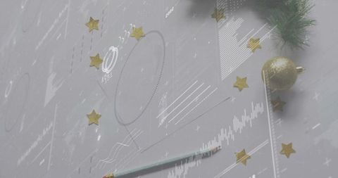 Minimal festive flatlay featuring gold bauble, pine sprig, mint pencil and star confetti