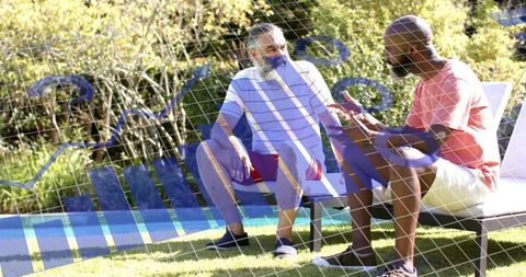 Two men chatting poolside while checking smartphone with digital data overlay, casual backyard