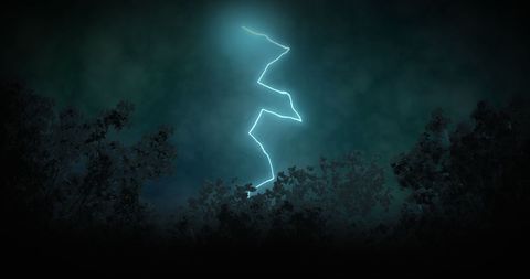 Dramatic lightning bolt in stormy night sky
