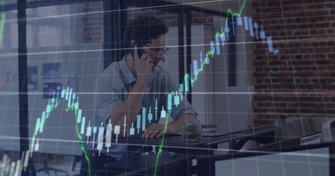 Businessman Analyzing Financial Graphs on Smartphone in Modern Office