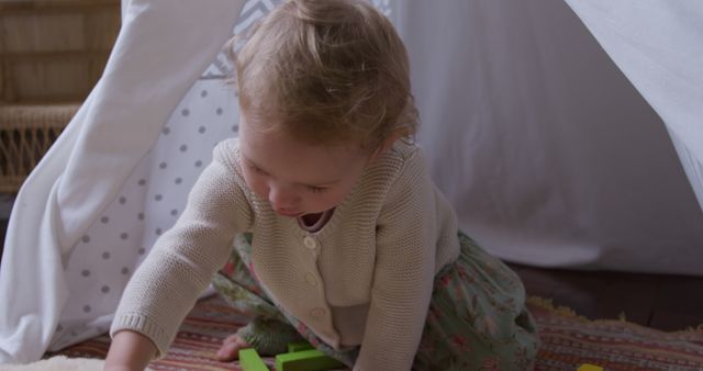 Toddler Girl Playing with Blocks in Cozy Indoor Tent - Download Free Stock Images Pikwizard.com