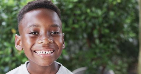 Joyful African American Boy Smiling Outdoors in Summer