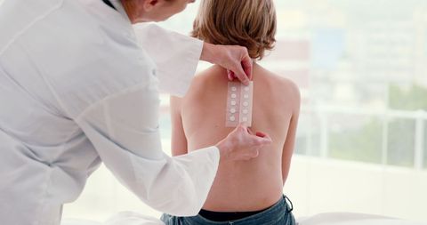 Healthcare Professional Applying Kinesiology Tape on Patient’s Back - Download Free Stock Images Pikwizard.com