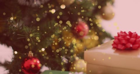 Festive Christmas Tree with Glowing Lights and Gift Box - Download Free Stock Images Pikwizard.com