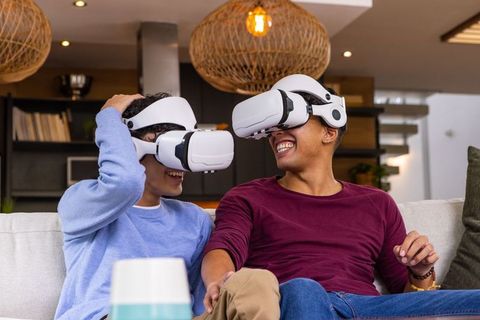 Diverse Friends Enjoying Virtual Reality Experience in Modern Living Room