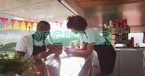 Baristas collaborating at outdoor coffee cart