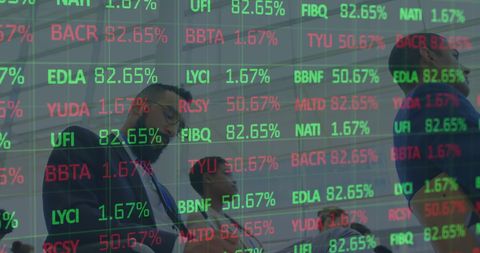 Financial Data Displaying Over Business Professionals in Meeting - Download Free Stock Images Pikwizard.com