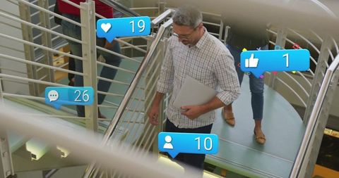 Creative Team Walking Downstairs with Social Media Icons