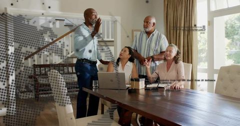 Multigenerational adults discussing project at dining table with laptop and microphone