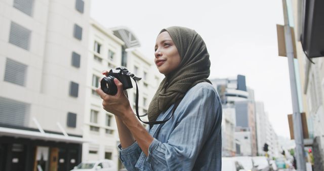 Muslim Woman Taking Photos in Urban Setting - Download Free Stock Images Pikwizard.com