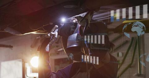 Female Auto Technician Inspecting Vehicle Undercarriage with Torch and Digital HUD