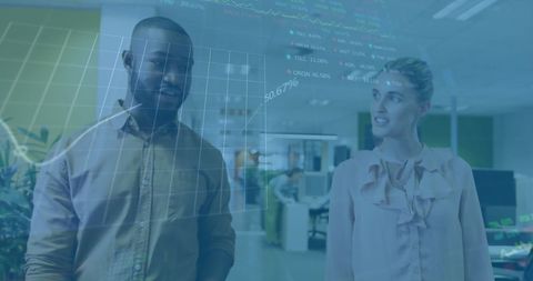 Diverse colleagues analyzing financial data with digital interface in office