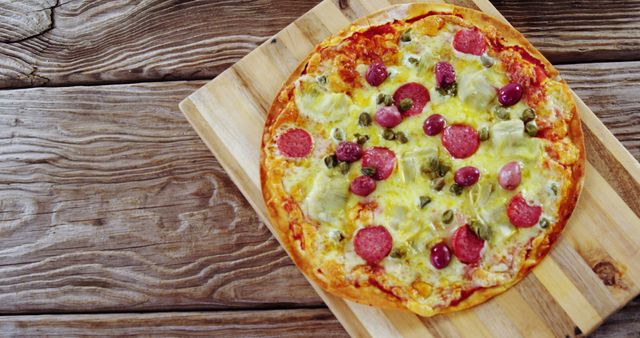 Freshly Baked Pizza with Mixed Toppings on Wooden Board - Download Free Stock Images Pikwizard.com