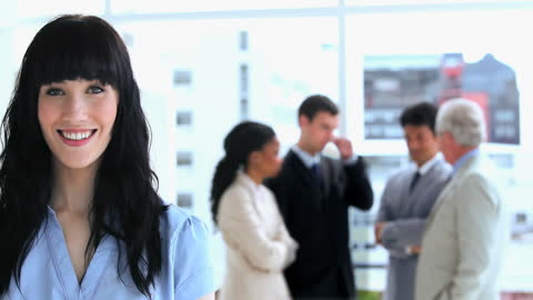 Confident Businesswoman Leading a Successful Team