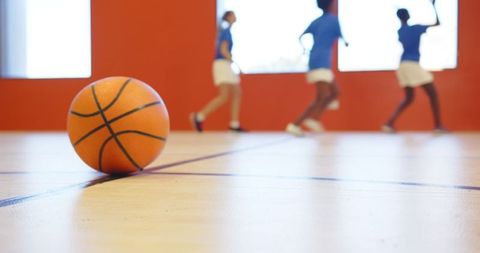 Girls’ Basketball in Full Motion on Indoor Court