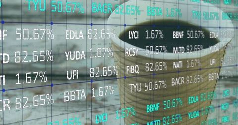 Takeaway coffee cup sitting on wooden desk with digital stock market ticker overlay