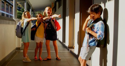 Group of Kids Bullying Sad Schoolboy in School Corridor - Download Free Stock Images Pikwizard.com