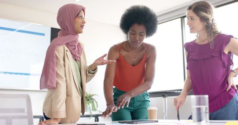 Diverse Female Colleagues Collaborating in Office Meeting