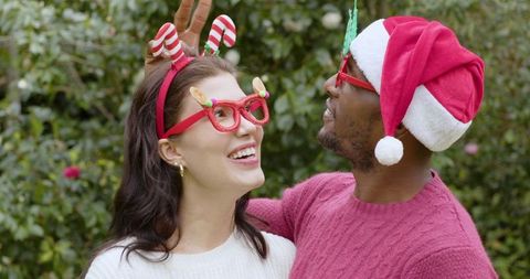 Diverse Couple Celebrating Outdoor Holiday in Festive Attire