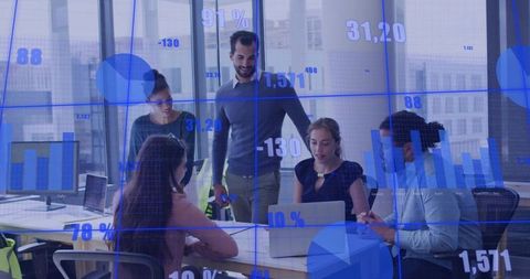 Business Team Collaborating around Laptop and Analyzing Data Visualization in Modern Office