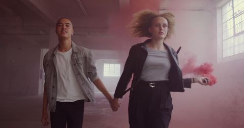 Diverse Couple Walking Through Colorful Smoky Room