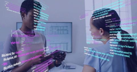 Professionals collaborating with holographic code over tablet in modern office workspace