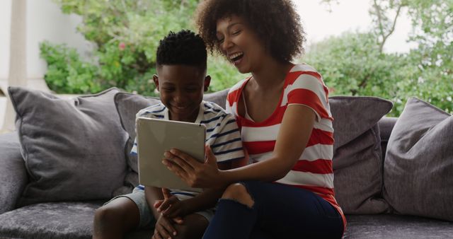 Mother and Son Enjoying Digital Tablet at Home - Download Free Stock Images Pikwizard.com