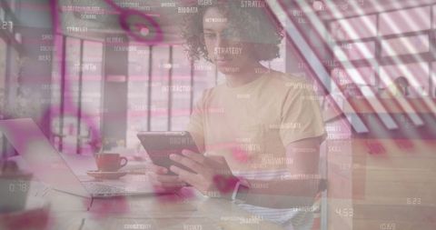 Innovation and Financial Data Overlay on Man Using Tablet in Office