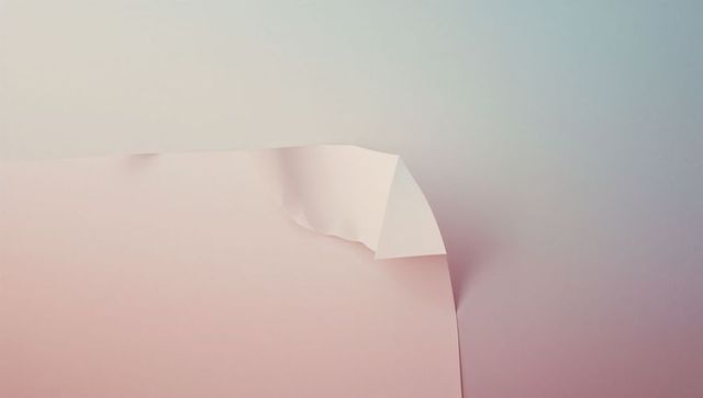 Pastel pink sheet with folded corner on gradient background