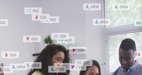 Coworkers Engaging in Social Media Teamwork Planning