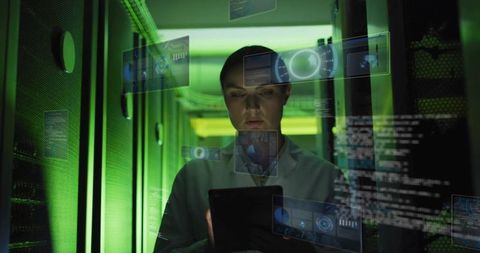 Female engineer monitoring server racks with holographic analytics interface in datacenter