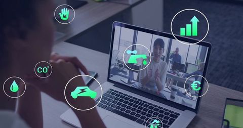 Remote team discussing sustainability metrics on laptop video call with green icons