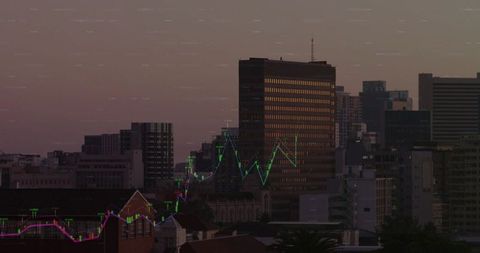 Dusk downtown skyline with reflective highrise and digital stock market chart overlay