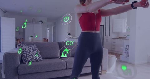 Woman exercising with smart fitness technology in modern apartment