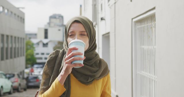 Young Woman Enjoying Coffee Outdoors in Urban Setting - Download Free Stock Images Pikwizard.com