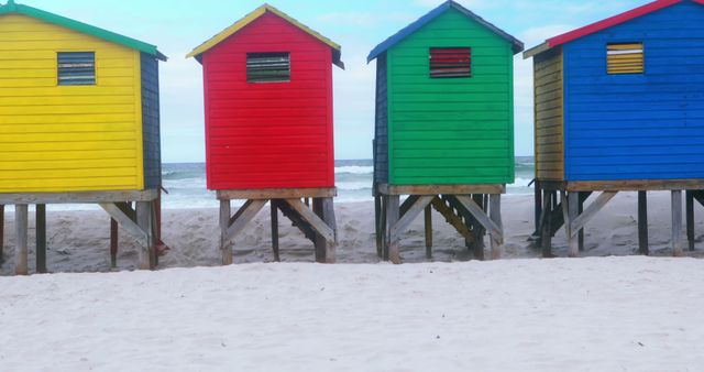 Multicolored Beach Huts on Sandy Shore Wave Background - Download Free Stock Images Pikwizard.com