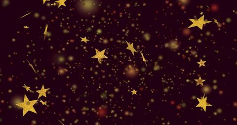 Floating gold stars and glittering bokeh over dark maroon backdrop for festive designs