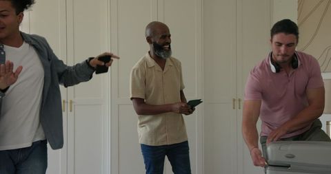 Friends Packing Suitcase for Wedding Celebration